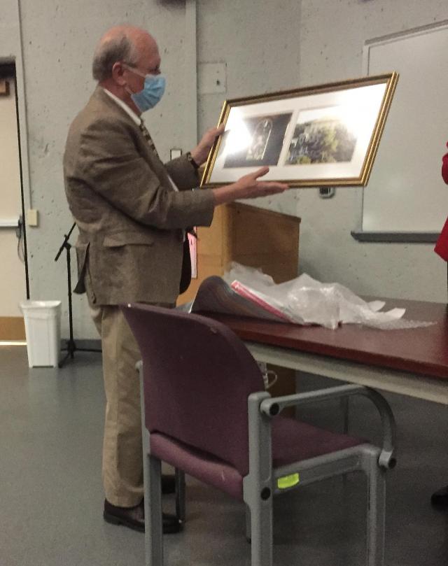 Prof. Staley with his gift, two framed photos of the American Academy in Rome, where he held a fellowship.
