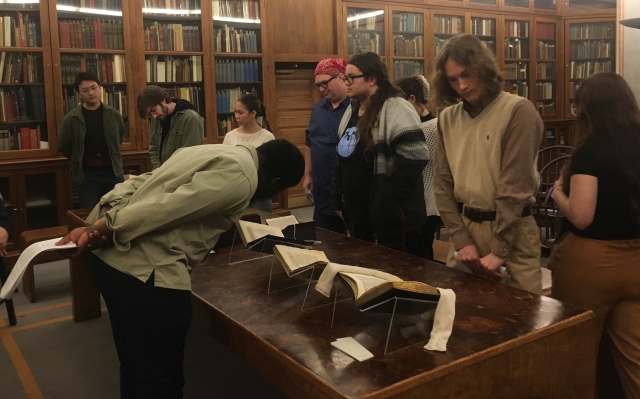 Classics students examine rare books